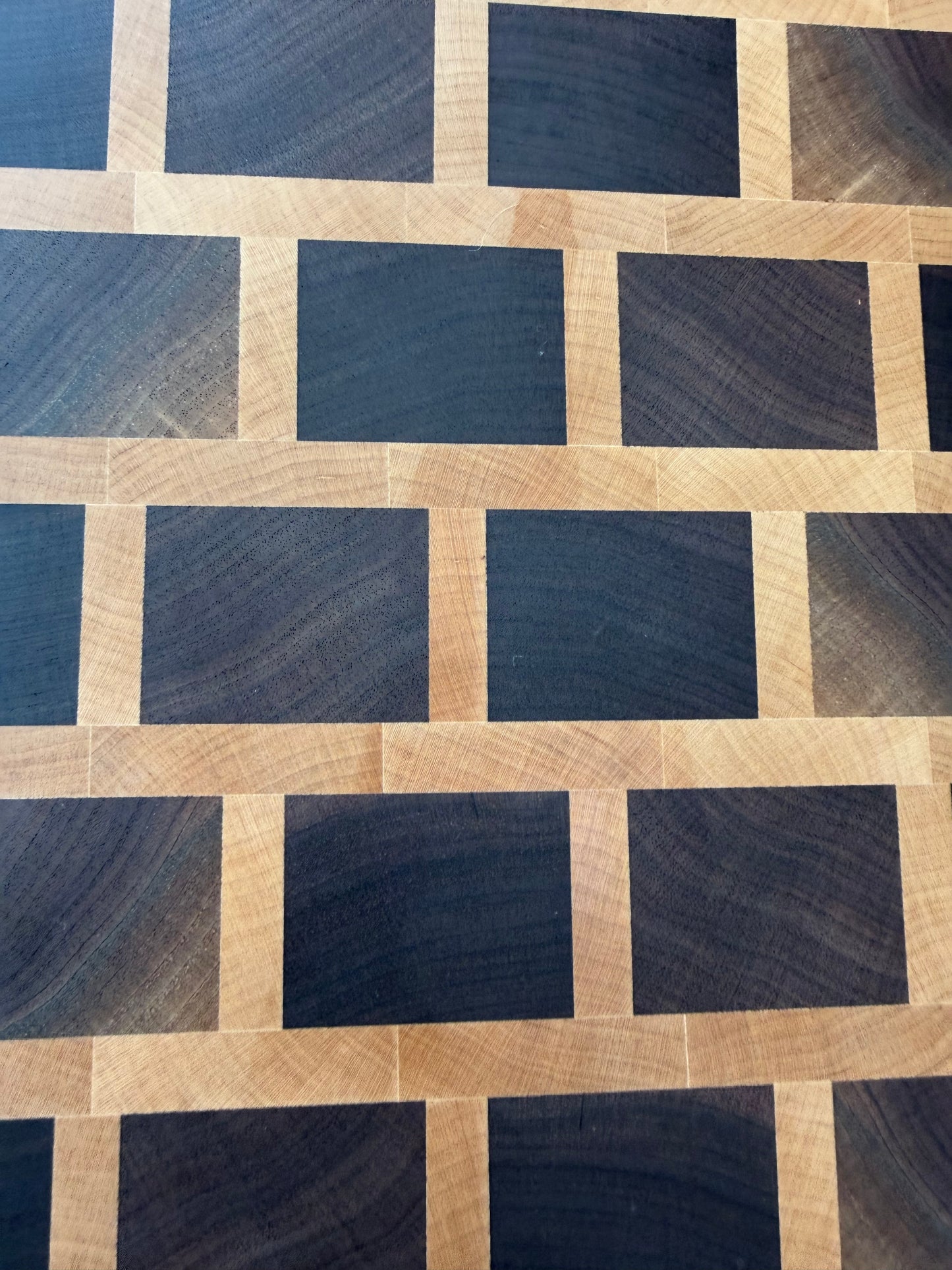 Wooden cutting board with a geometric pattern
