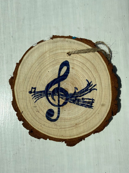 Wooden ornament with a blue music note design on a textured white background