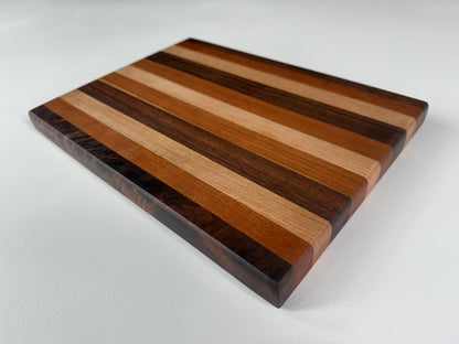 Wooden cutting board with striped pattern on a white background