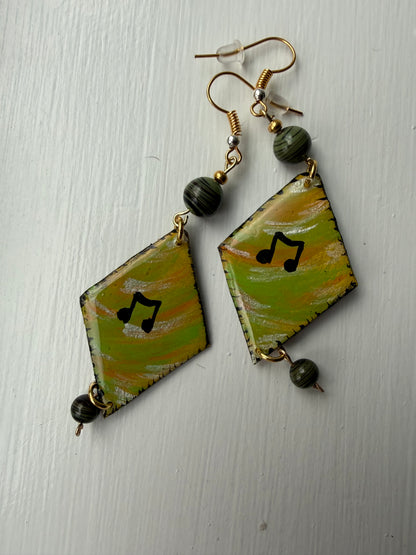 Pair of earrings with music note on each one