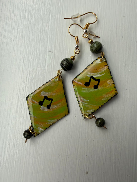 Pair of earrings with music note on each one