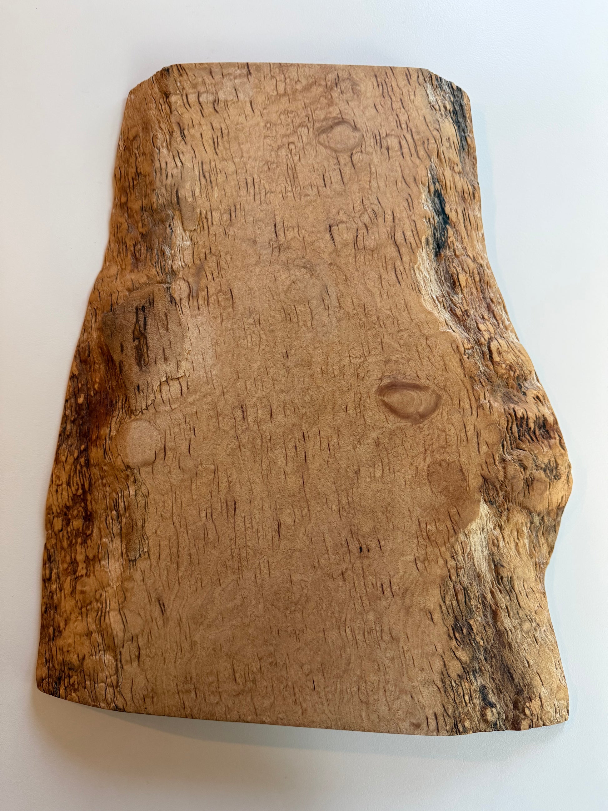 Wooden flame maple charcuterie board with natural grain