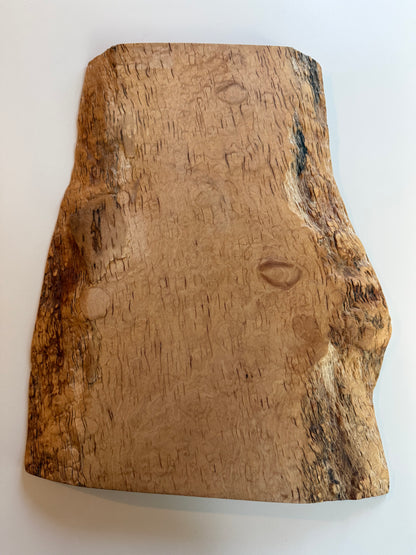 Wooden flame maple charcuterie board with natural grain