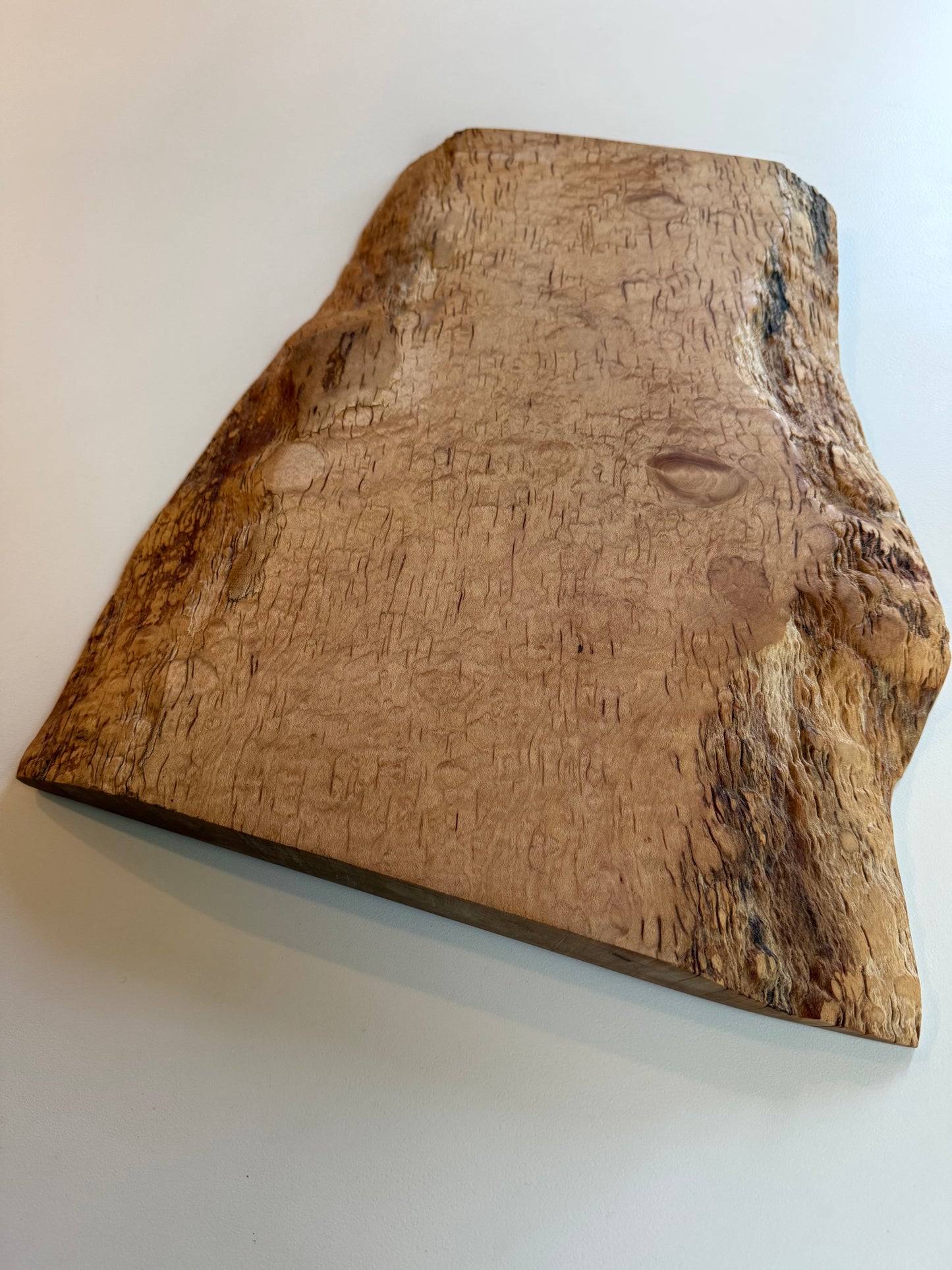 Wooden flame maple charcuterie board with natural grain