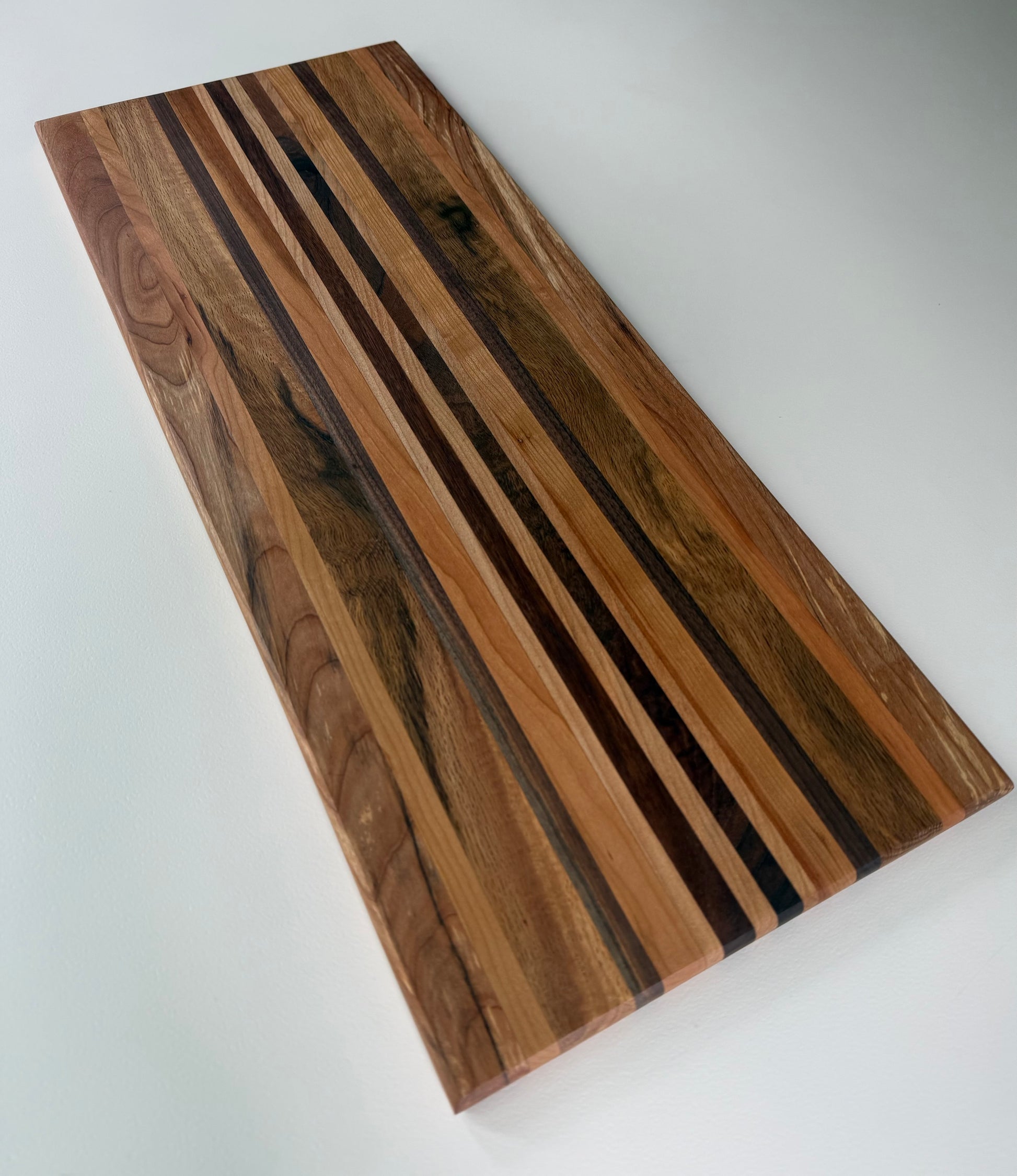 Wooden cutting board with a striped pattern