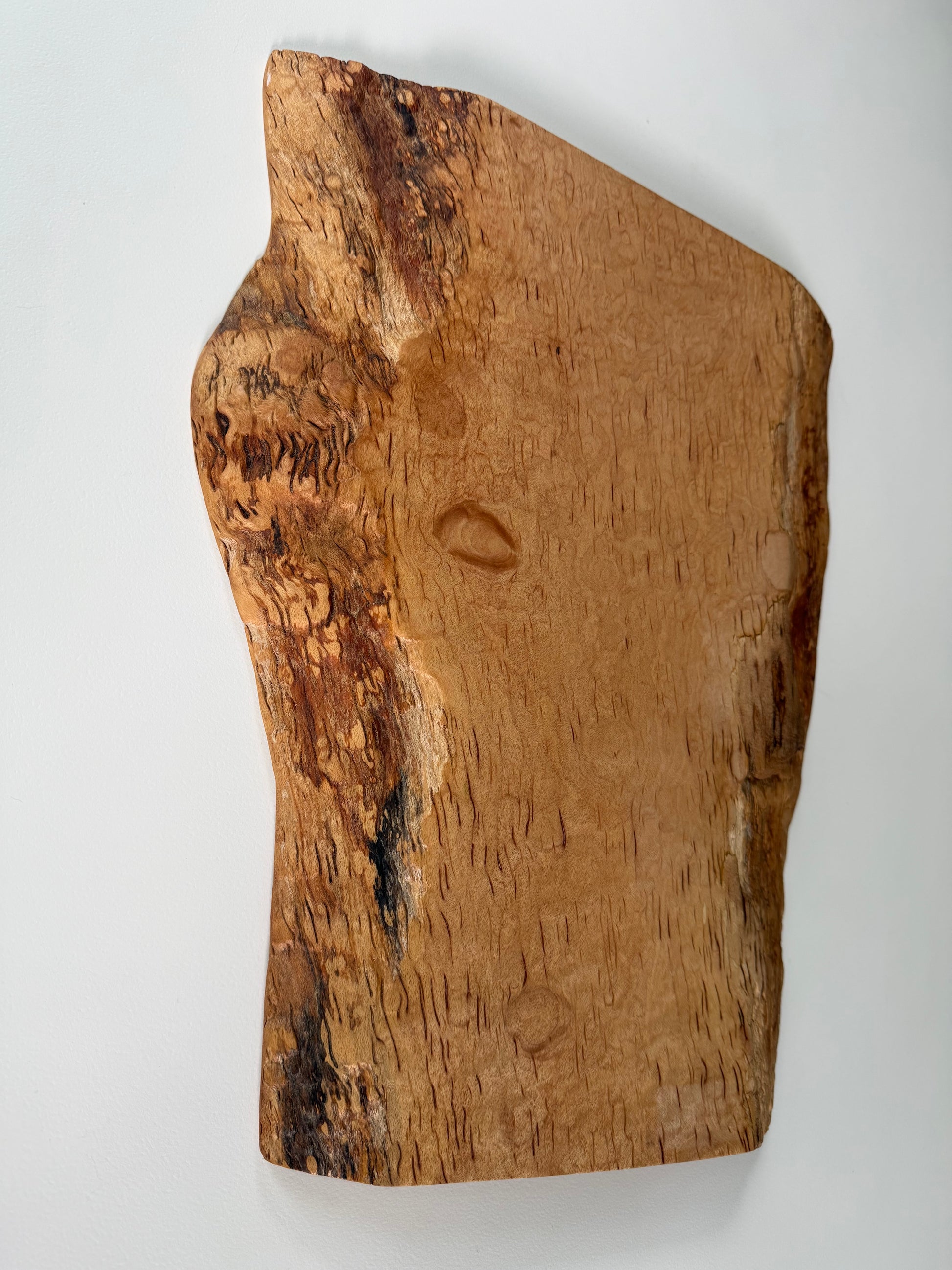 Wooden flame maple charcuterie board with natural grain
