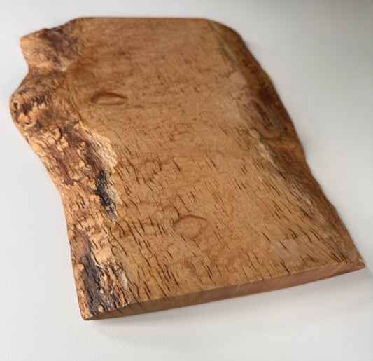 Wooden flame maple charcuterie board with natural grain