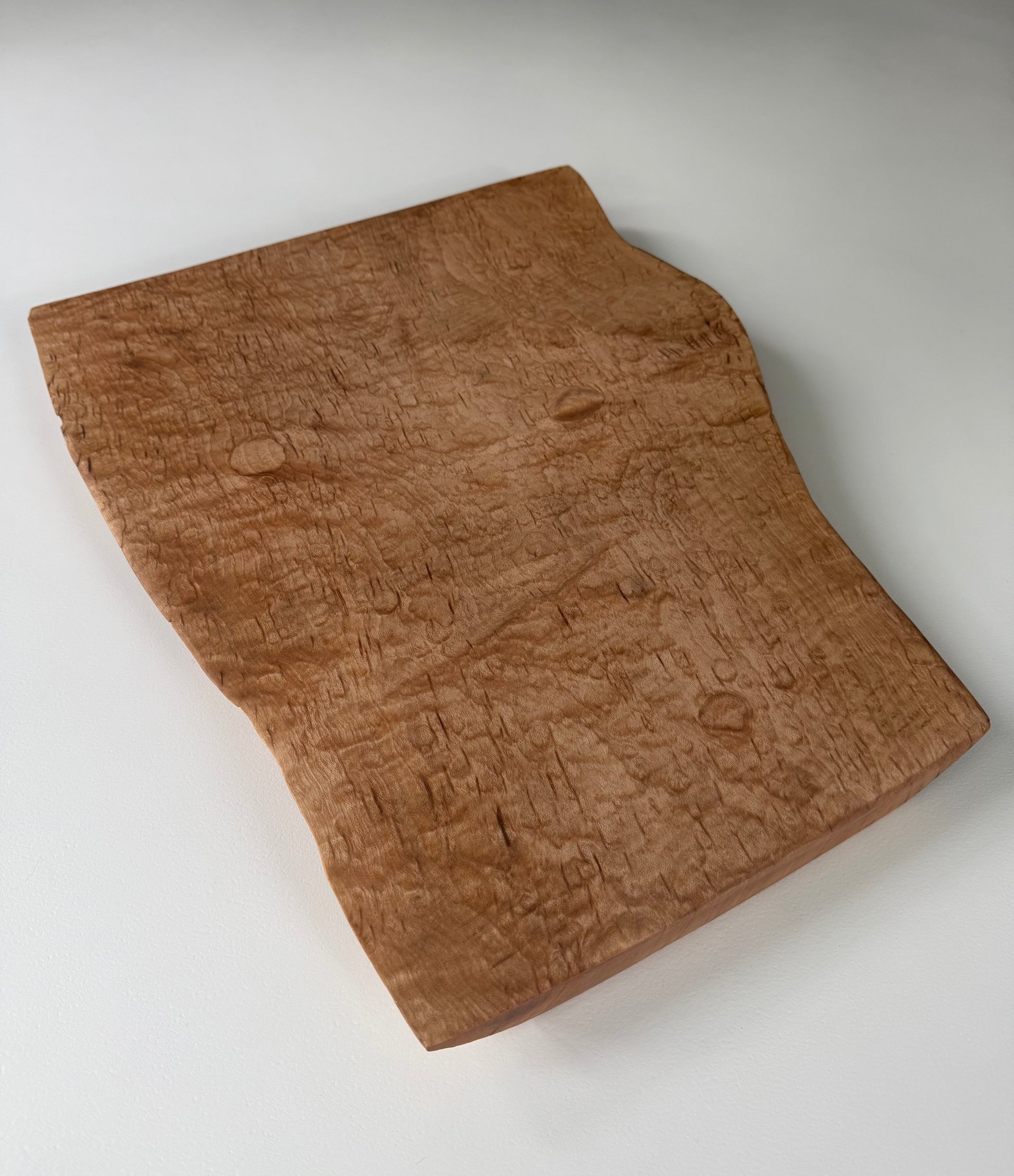 Wooden flame maple charcuterie board with natural grain