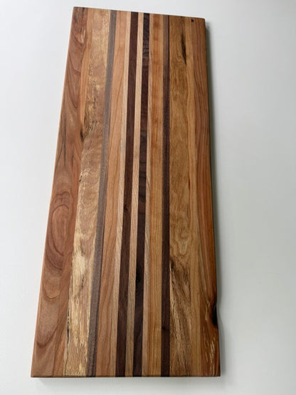 Wooden cutting board with a striped pattern