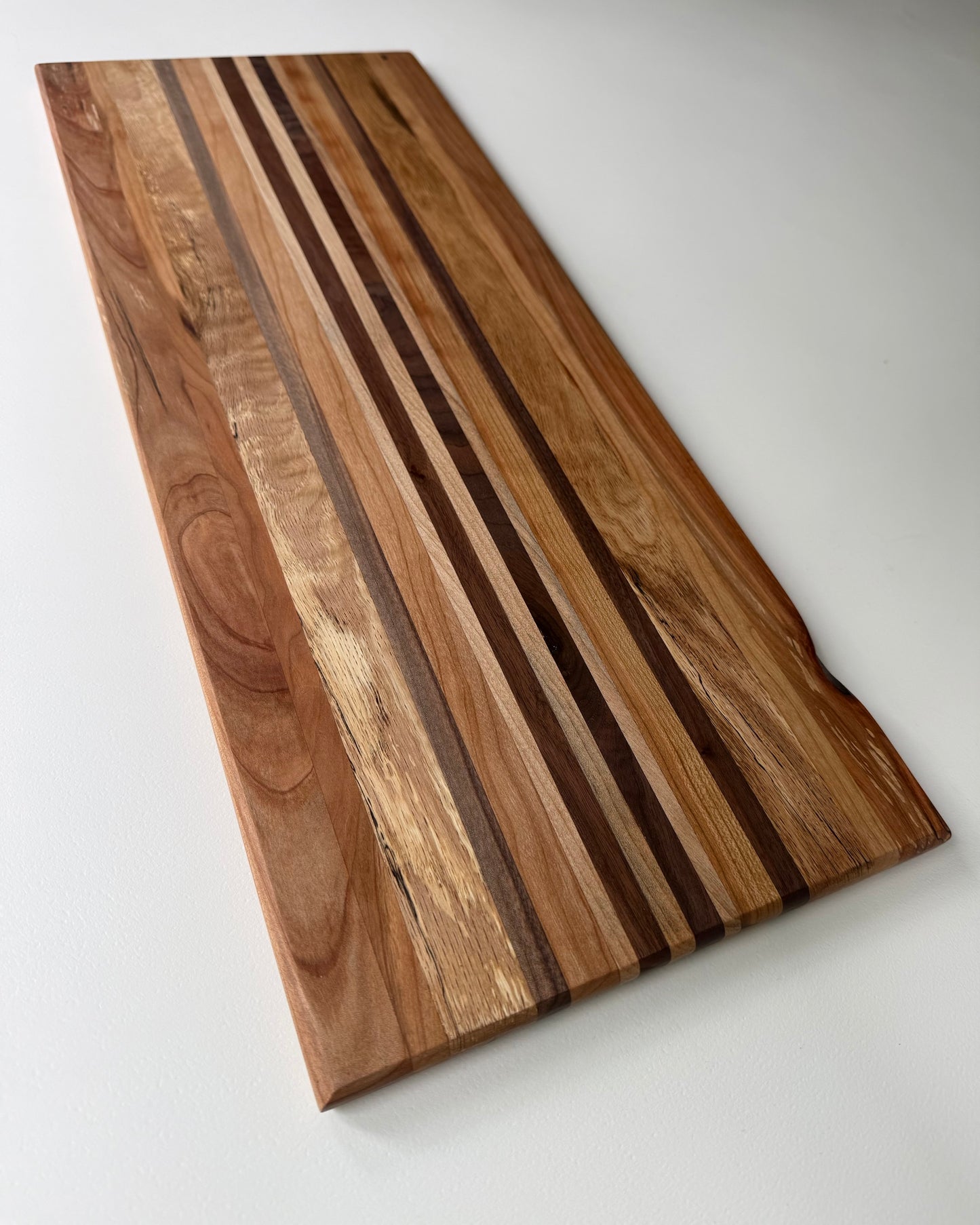 Wooden cutting board with a striped pattern