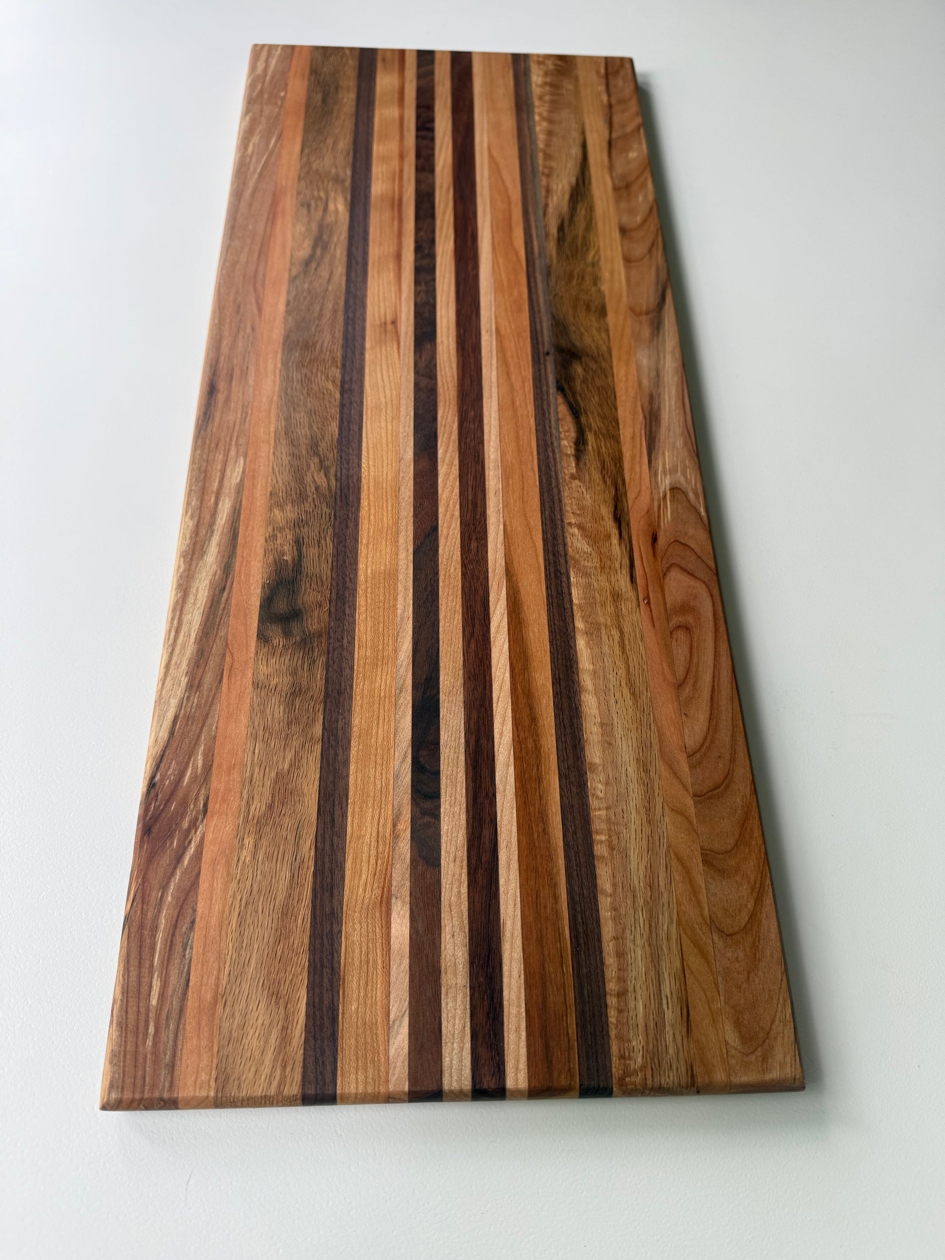 Wooden cutting board with a striped pattern