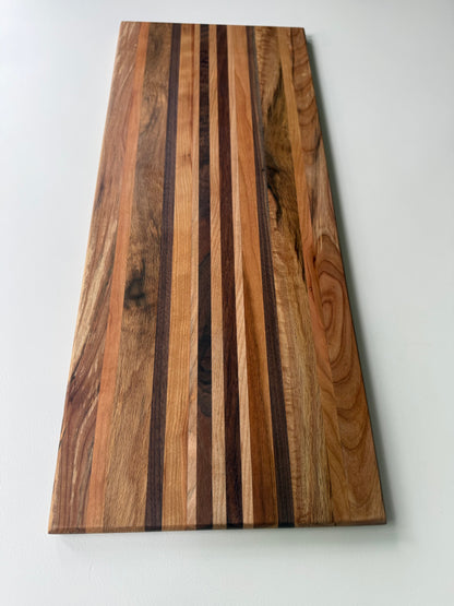 Wooden cutting board with a striped pattern