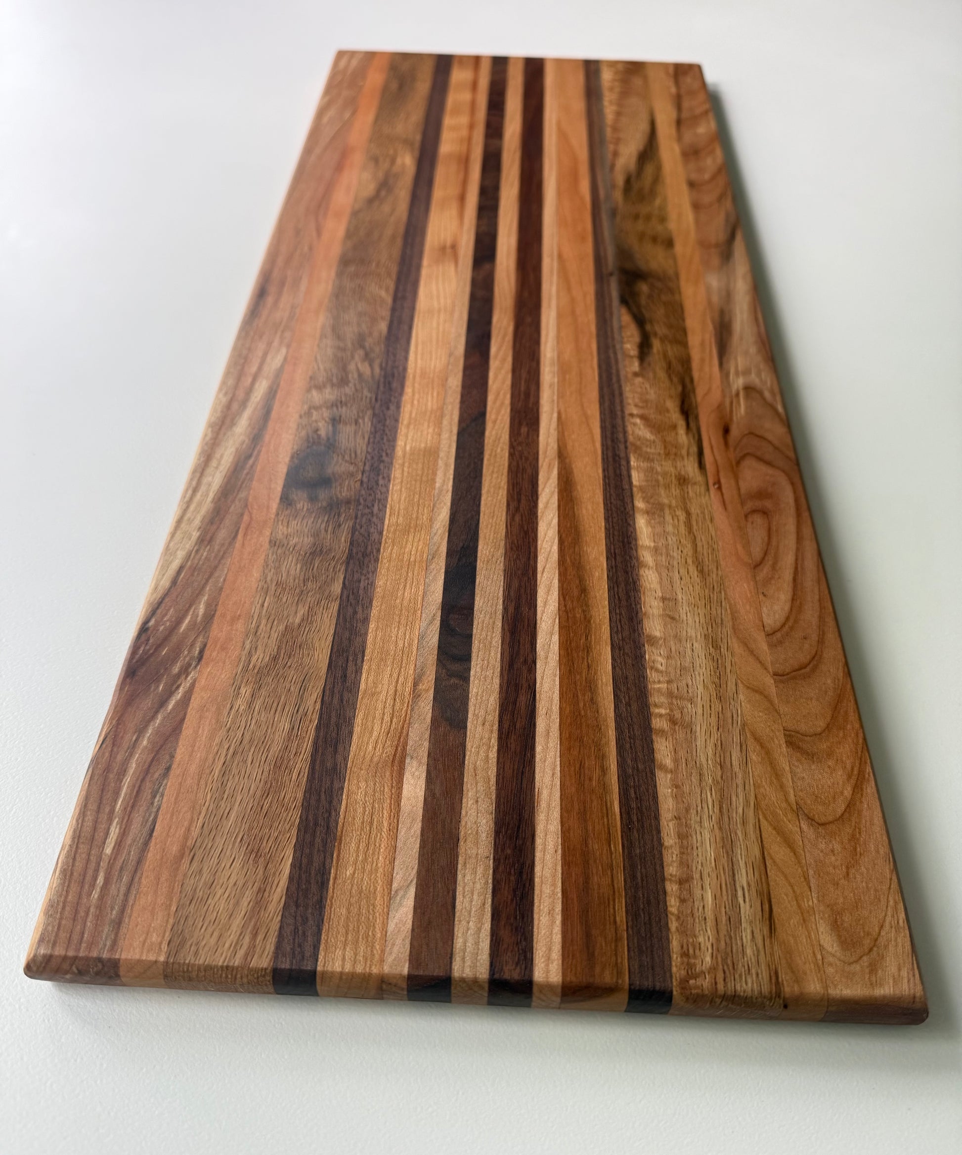 Wooden cutting board with a striped pattern