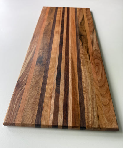 Wooden cutting board with a striped pattern