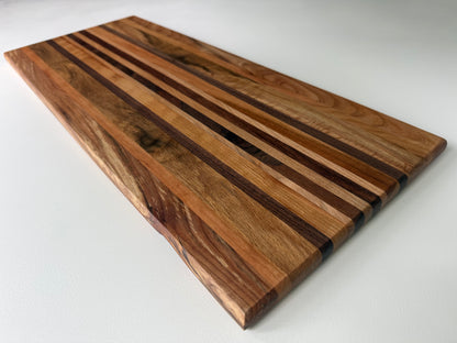 Side angle of a striped wooden cutting board
