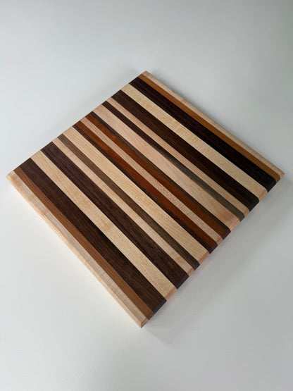 Wooden cutting board with striped pattern on a white background