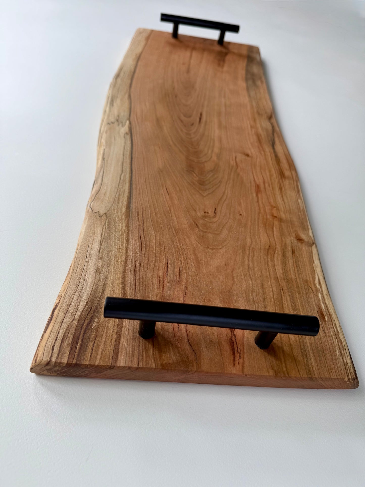 Charcuterie board with black handles