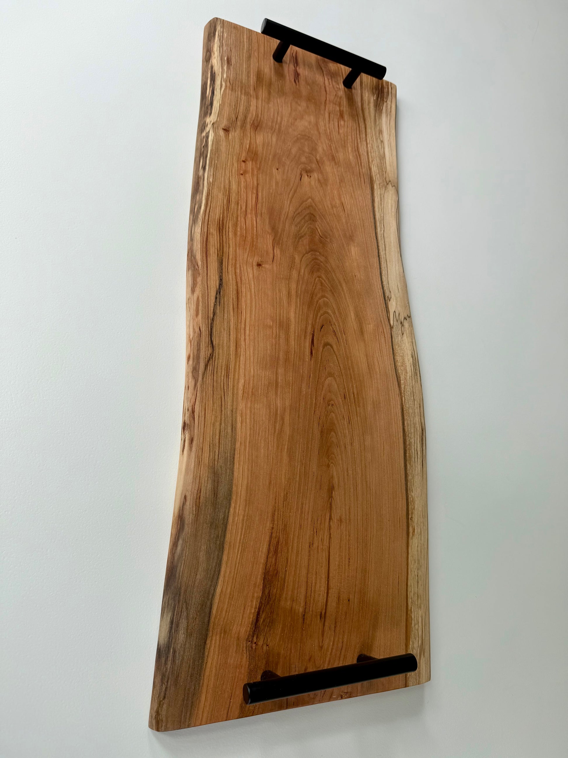 Charcuterie board with black handles