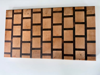 Wooden cutting board with a checkered pattern on a white background
