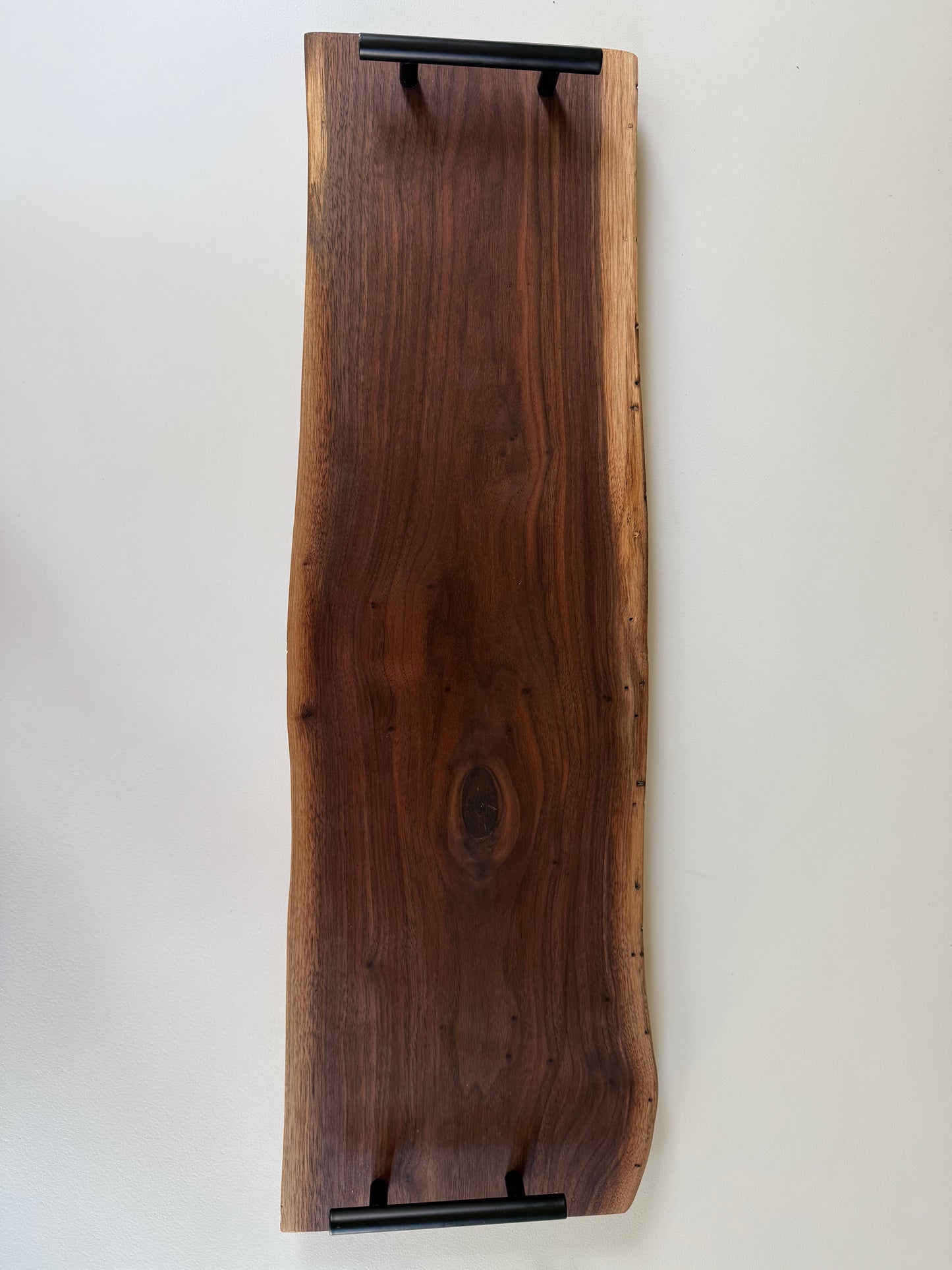 Spalted walnut charcuterie board with black handles 