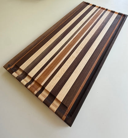 Wooden cutting board with striped pattern on a white background