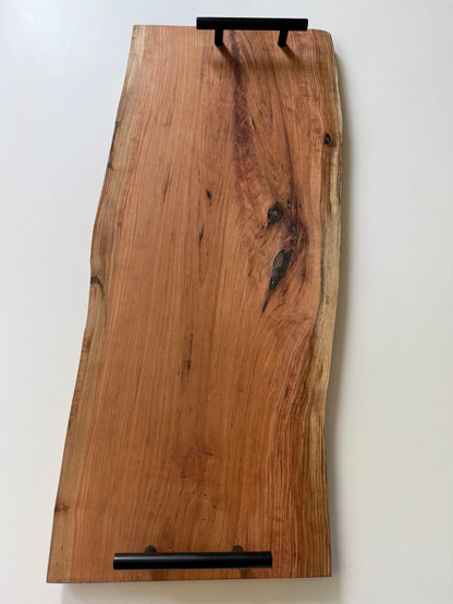 Wooden charcuterie board with black handles