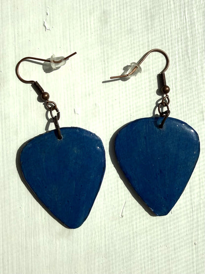 Blue earrings on a white background