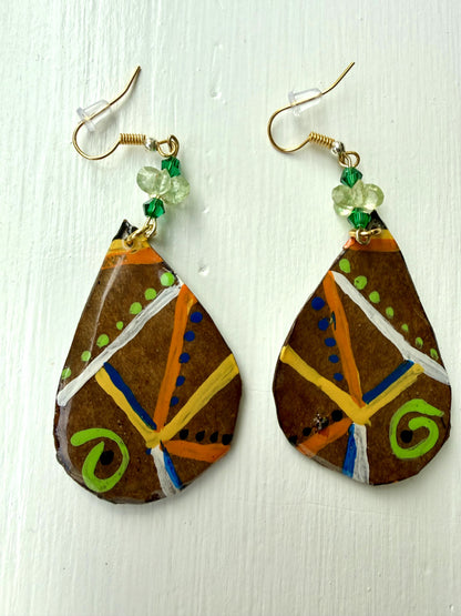 Teardrop-shaped earrings with colorful patterns on a white background