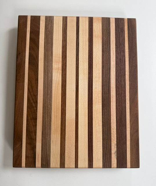Wooden cutting board with striped pattern on a white background