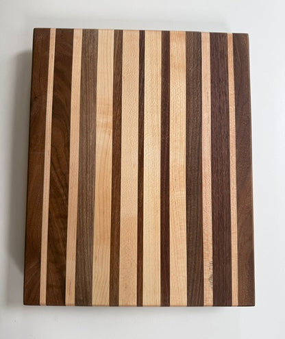 Wooden cutting board with striped pattern on a white background