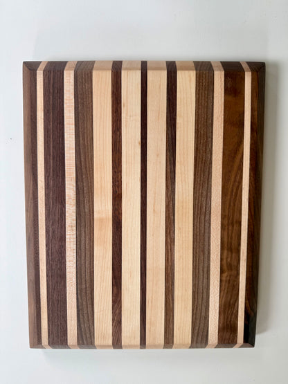 Wooden cutting board with striped pattern on a white background