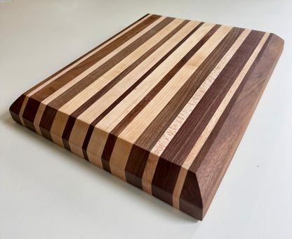 Wooden cutting board with striped pattern on a white background